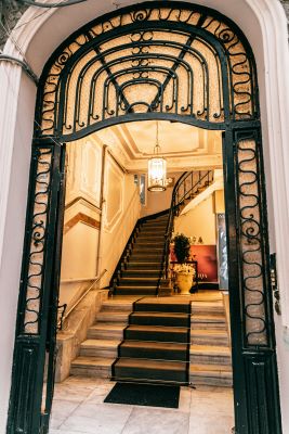 Entrance to a large house with stairs leading up onto the next floor