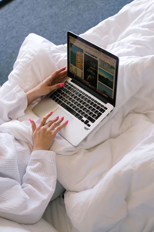 Person looking at their part and part mortgage options on a laptop in bed